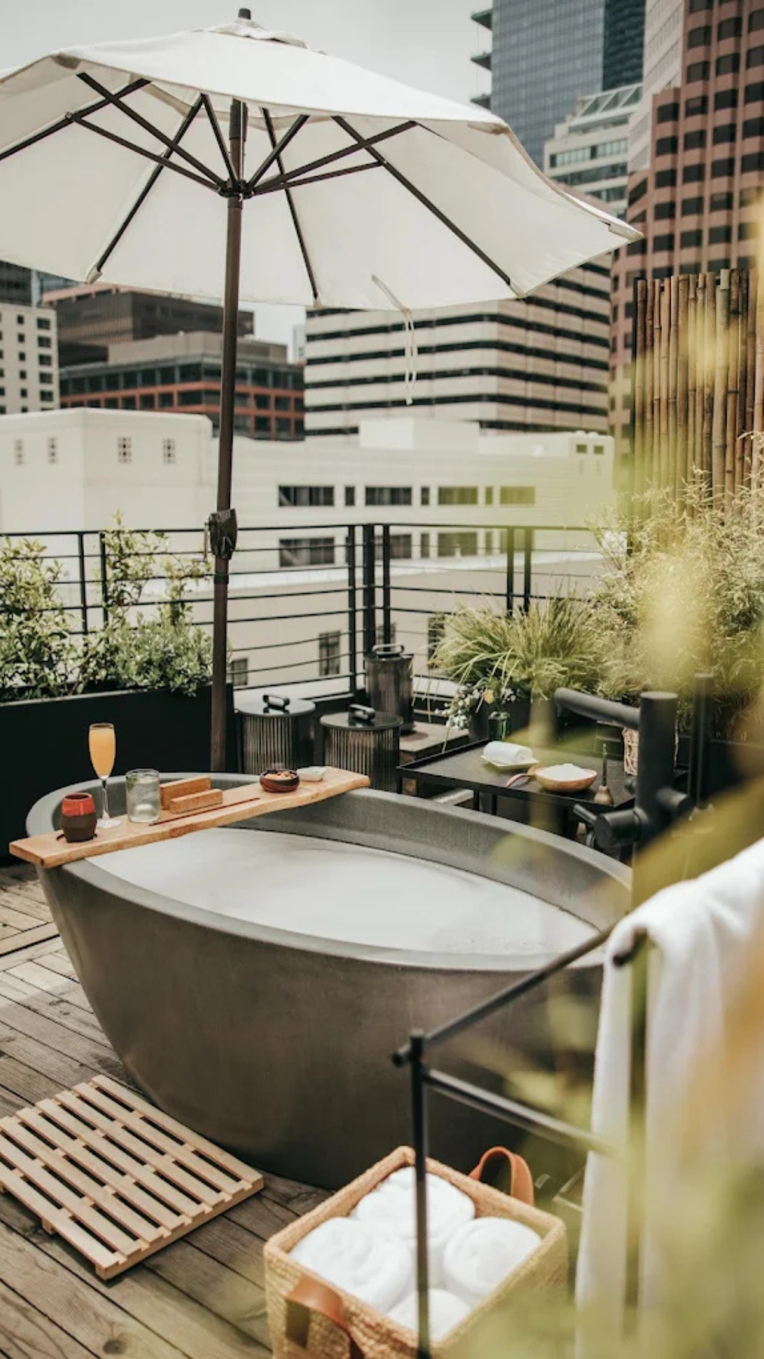 Rooftop tub with a view of the city